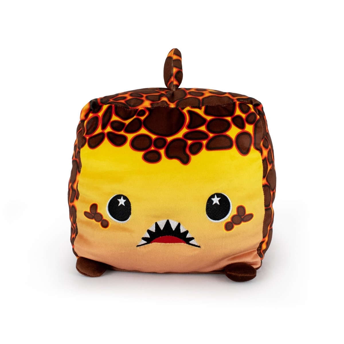 Pele the Lava Shark is a cube-shaped, machine-washable plush toy with a lava-like pattern, small brown feet, a top tail, big starry eyes, and a red mouth with sharp white teeth—perfect for any collection.