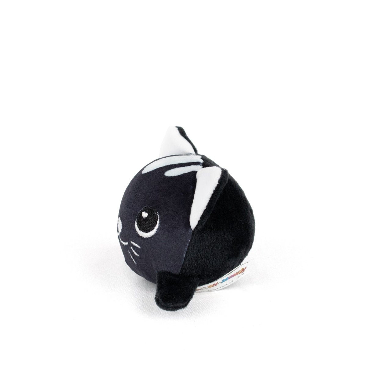 The Fortune Spooky Plushy Skwishy is a small, round black cat plush toy with large white eyes, white-tipped ears, and stitched whiskers, shown against a plain white background.