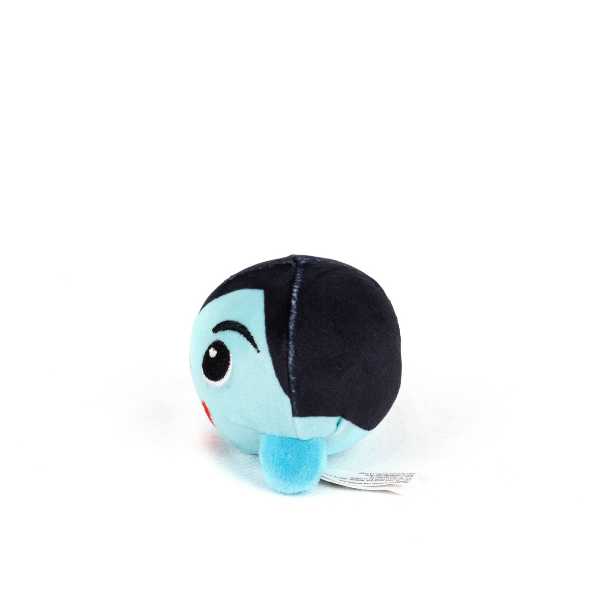 The Vlad Spooky Plushy Skwishy is a small, round plush toy with light blue fabric, black hair, a smiling face, and a white tag, shown on a white background.