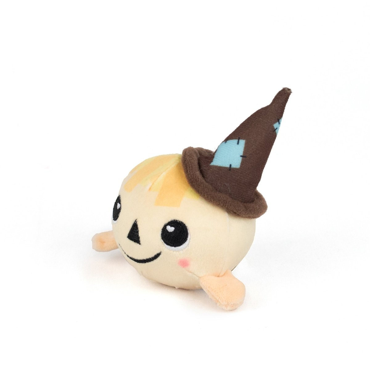 The Gretel Spooky Plushy Skwishy is a round plush toy with a smiling face, blushing cheeks, light yellow hair, small arms, and a pointed brown witch hat decorated with blue patches. It sits on a white background.