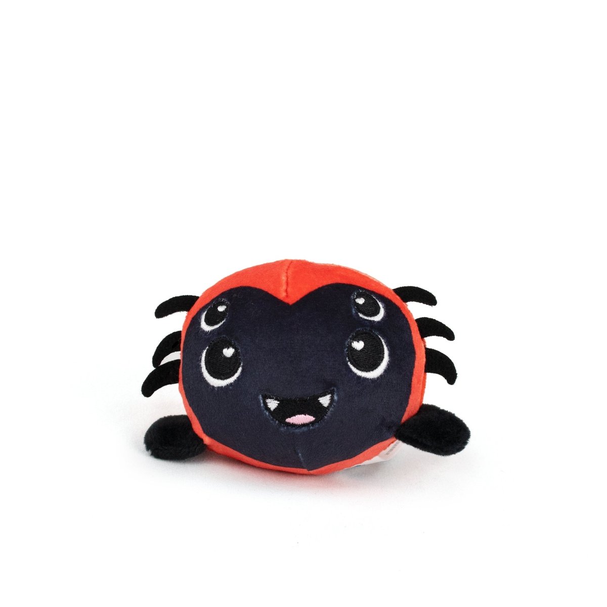 The Muffet Spooky Plushy Skwishy is a round, plush spider toy featuring a red body, black face, four cartoon eyes, a smiling mouth with fangs, and soft black felt legs—perfect for cuddles.