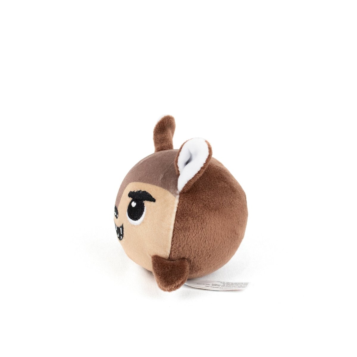 The Lobo Spooky Plushy Skwishy is a small, round, brown plush toy with pointy ears, embroidered eyebrows, eyes, and fangs, resembling a cartoon animal against a white background.