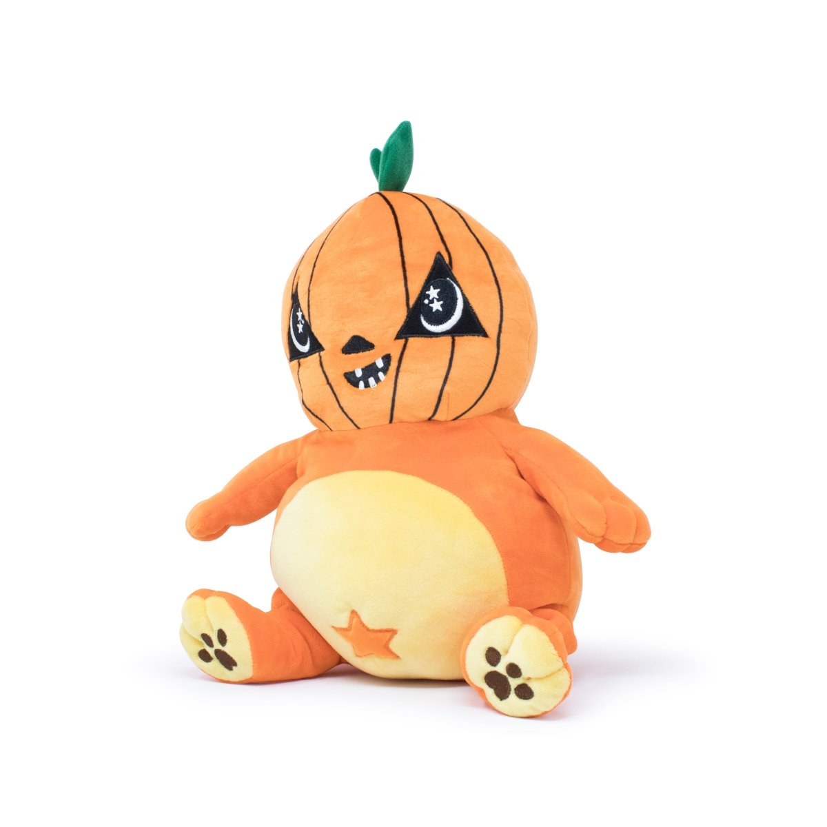 The Vincent the Pumpkin Plushie Starlight Buddy features an orange pumpkin head with a mischievous grin, stitched star eyes, and a round orange-yellow body adorned with star and paw print details. A charming green stem tops it off.