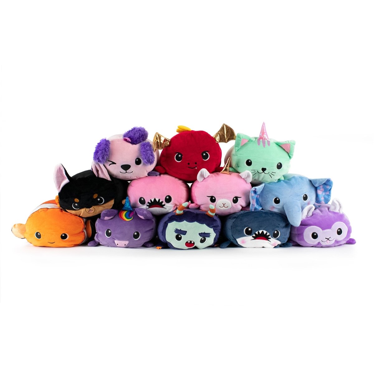 A collection of plushies in vibrant rows includes animal toys like cats, unicorns, bats, sharks, octopuses, and Finster the Clown Fish Plushie—each boasting unique colors and features such as horns, wings, and rainbow patterns.
