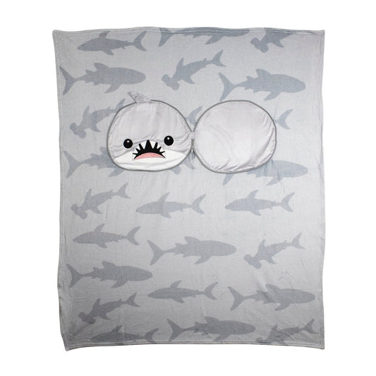 The 2-in-1 Pillow Blanket - Crush the Shark is a gray blanket with shark silhouettes and a sewn-on hood shaped like a cartoon shark head, featuring a wide open mouth and cute eyes.