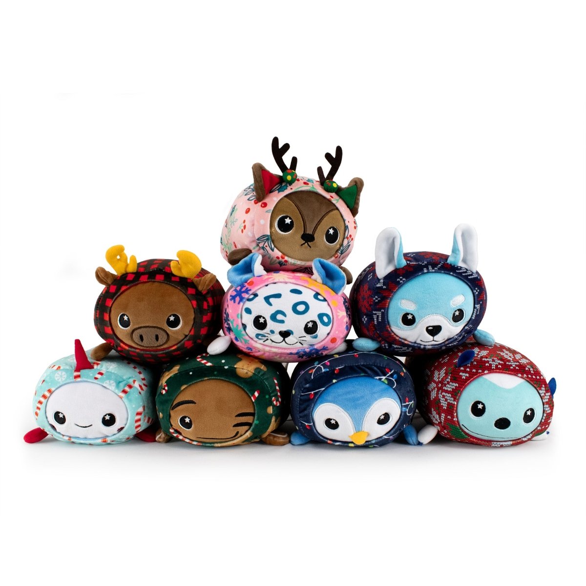 Snowie the Snow Leopard Slumber—a round, colorful Christmas plush—resembles a cute snow leopard and is perfect for festive holiday decorations on a white background.