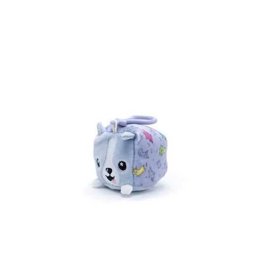 The charming Connie the Corgi Square Plush Clip-On is a gray and white cube-shaped toy with ears, a tail, and an adorable face. As part of the Moosh-Moosh Series 1 Squared collection, it features colorful side patterns.