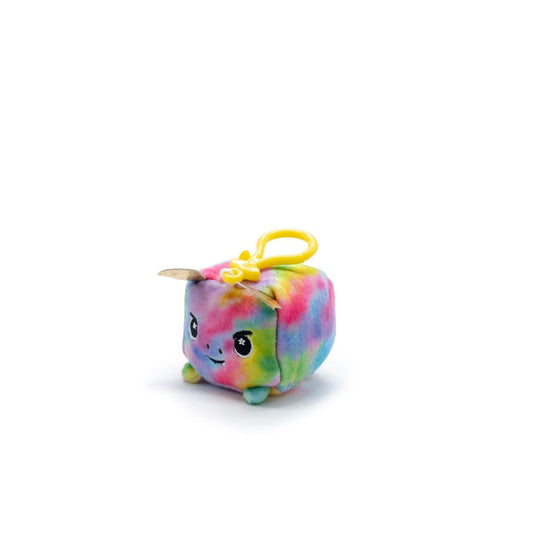 Emery the Dragon Square Plush Clip-On from Moosh-Moosh Series 1 is a small, vibrant plushie cube with a smiling face and tiny feet. It features a colorful tie-dye pattern of pink, blue, and green on white and includes a convenient yellow clip for hanging.