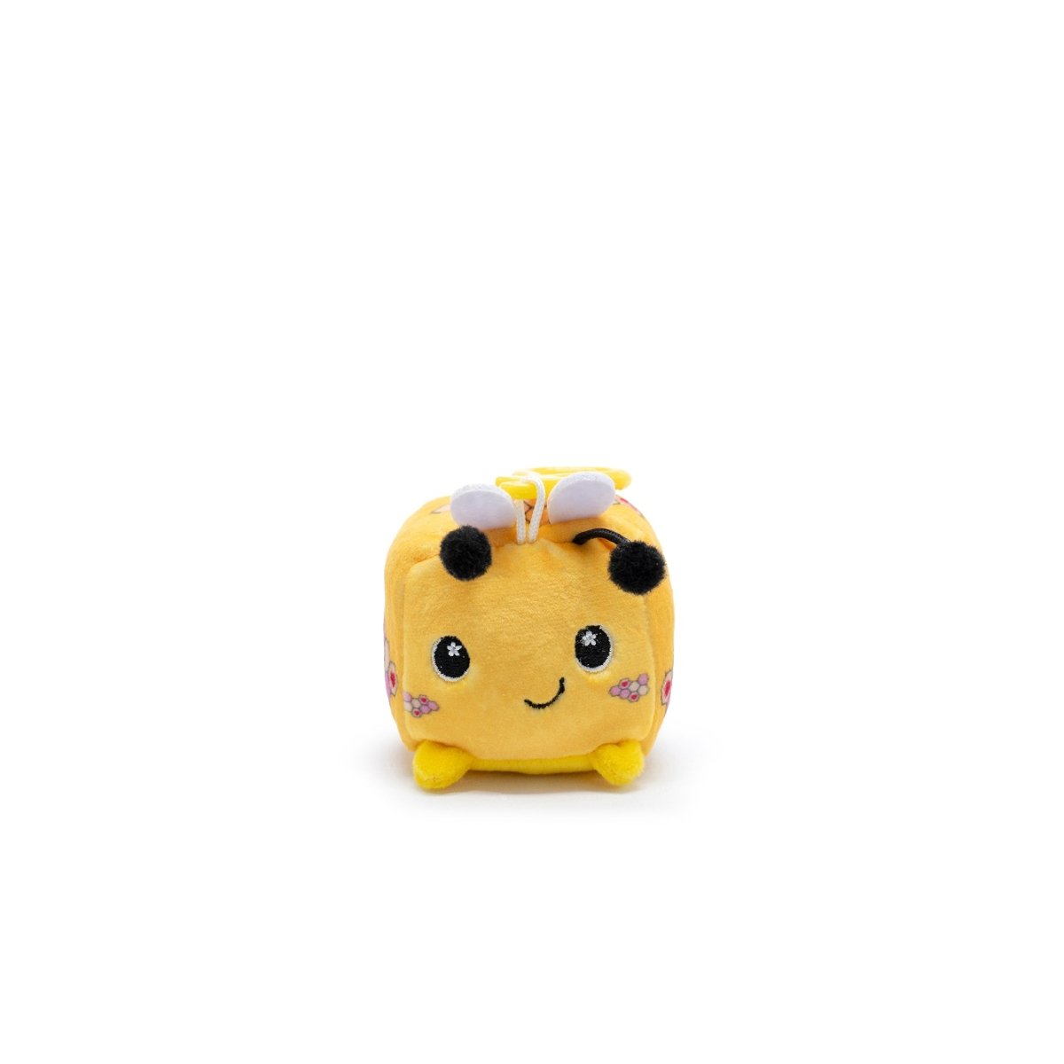 Hex the Bee Square Plush Clip-On is a small, square, yellow plush from Moosh-Moosh Series 1. It has black eyes, a smile, pink sparkly cheeks, tiny black antennas, and white wings. Perfect as a clip-on companion against a plain white background.
