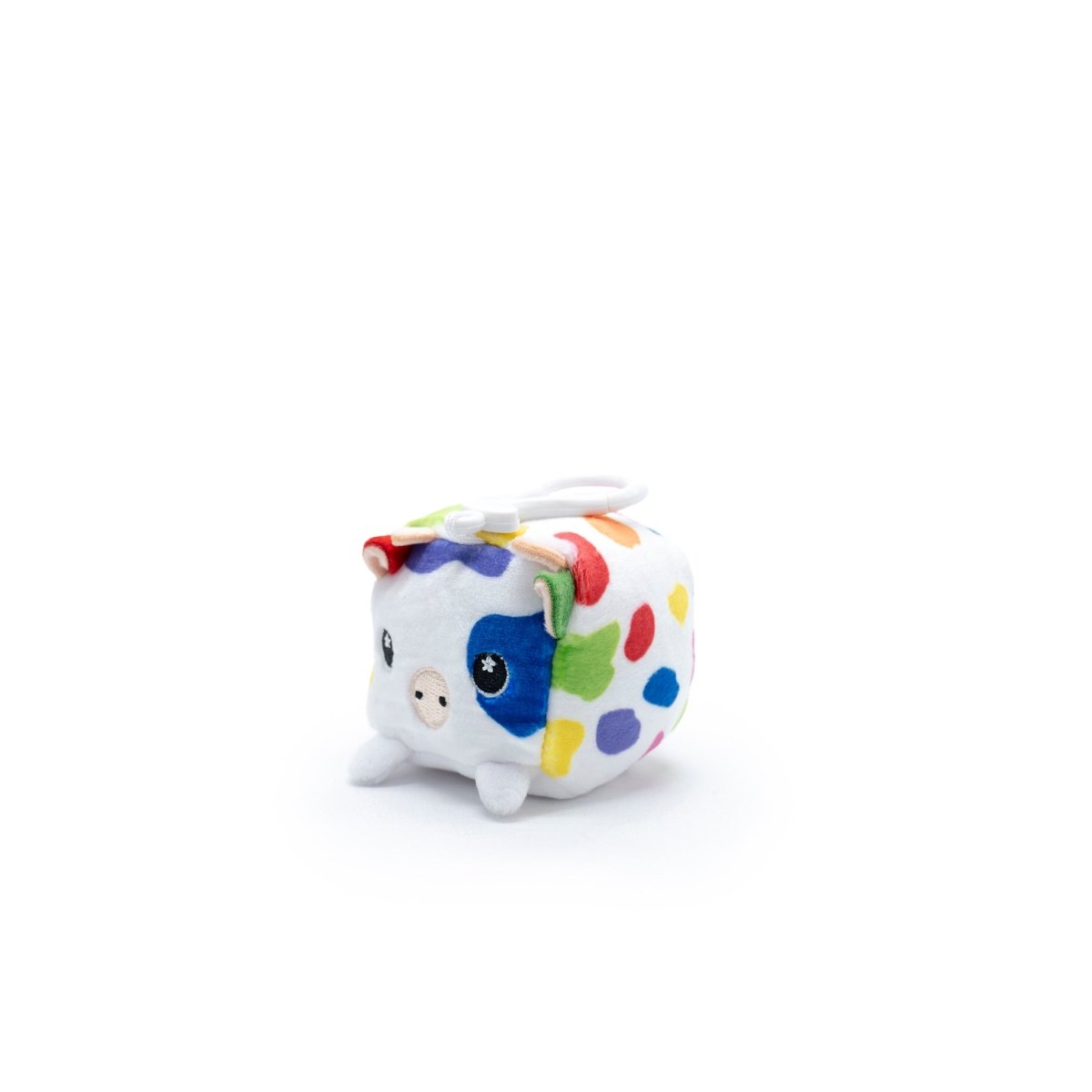 Milly the Cow Square Plush Clip-On from Moosh-Moosh Series 1 is a small square plushie with a white body and colorful spots, featuring round eyes, a pink snout, and short legs on a plain white background.
