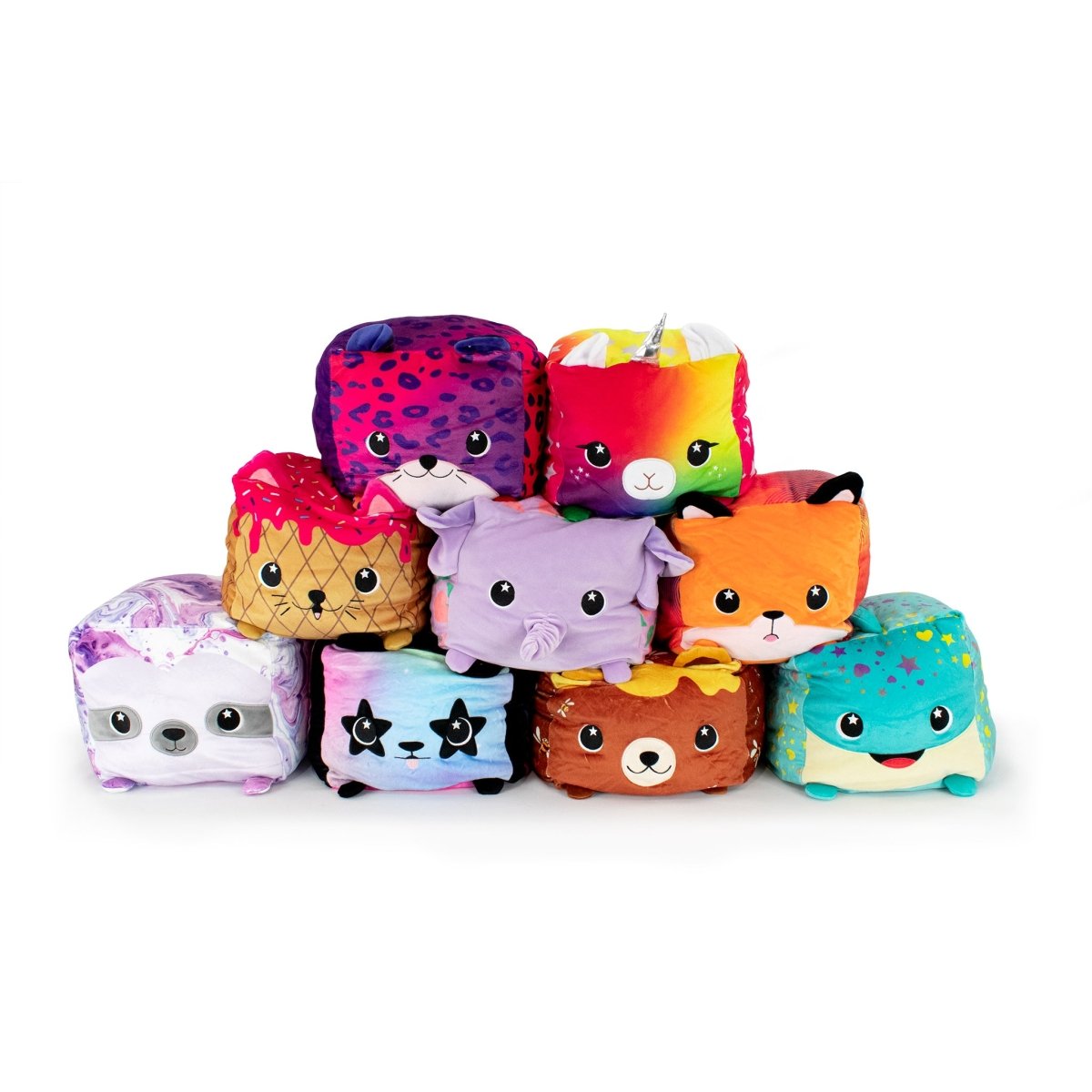 A collection of nine vibrant cube-shaped plushies showcases diverse animal faces, including a unicorn, fox, sloth, and the delightful Bonnie the Whale. Each toy is uniquely adorned with bright patterns and colors.