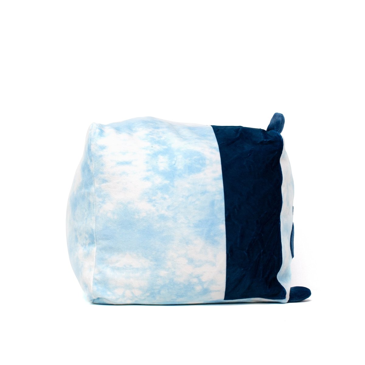 The Tonya the Panda Plushie is a cube-shaped pillow featuring a sky blue tie-dye pattern on one side and solid dark blue on another, with little blue fabric ears on top, adding an adorable touch against its white background.
