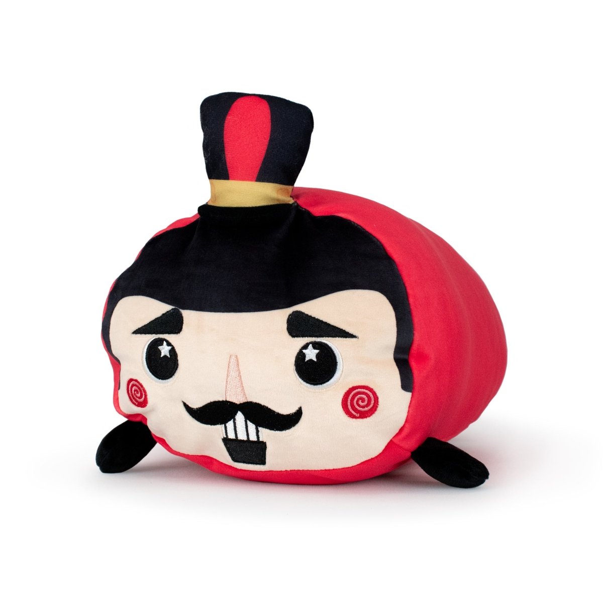 Voski the Nutcracker is a plush toy shaped like a red circus ringmaster, featuring a black mustache, rosy cheeks, a top hat, small black arms, and a round body—perfect for fans of adorable stuffed plushies.