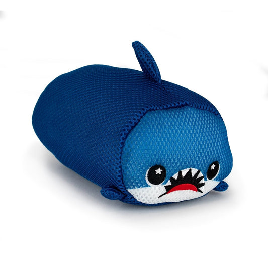 The Aqua Moosh-Moosh Azul is a plush toy shaped like a blue shark, featuring a rounded body, small fins, and a comical face with big eyes and sharp teeth, shown against a white background.