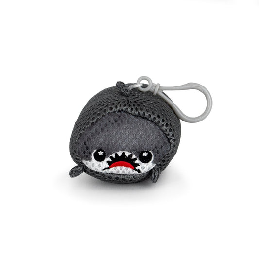 The Aqua Plush Clip-on Crush is a small, water-friendly shark keychain with a mesh texture, wide eyes, red frown, and gray clip on top. Made from fast-drying plush fabric, it’s shown against a plain white background.
