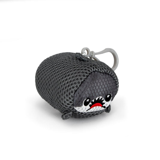 The Aqua Plush Clip-on Crush is a small, cylindrical gray mesh plush toy with a cartoon shark face—big eyes, sharp white teeth, and a red mouth. Made from fast-drying fabric for bath or pool use, it features a gray plastic clip for easy hanging.