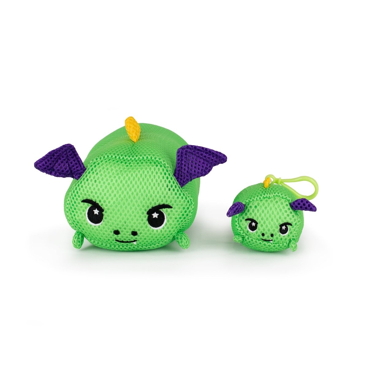 Two Aqua Moosh-Moosh Drac plush dragons, both green with purple ears, black eyes, and a yellow horn, sit side by side; the larger plush pairs with a smaller keychain version. Both are water-friendly and fast-drying for easy care.