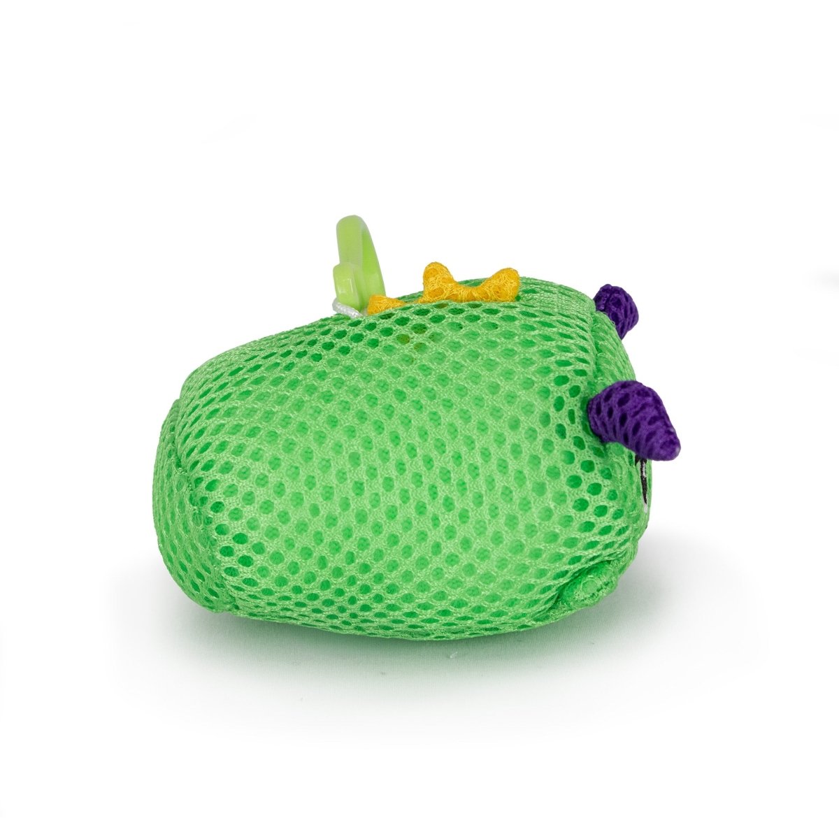 The Aqua Plush Clip-on Drac, a small green mesh plush toy with two purple horns, a yellow bump, and a green clip, perfect for bath or pool play, rests on its side against a white background.