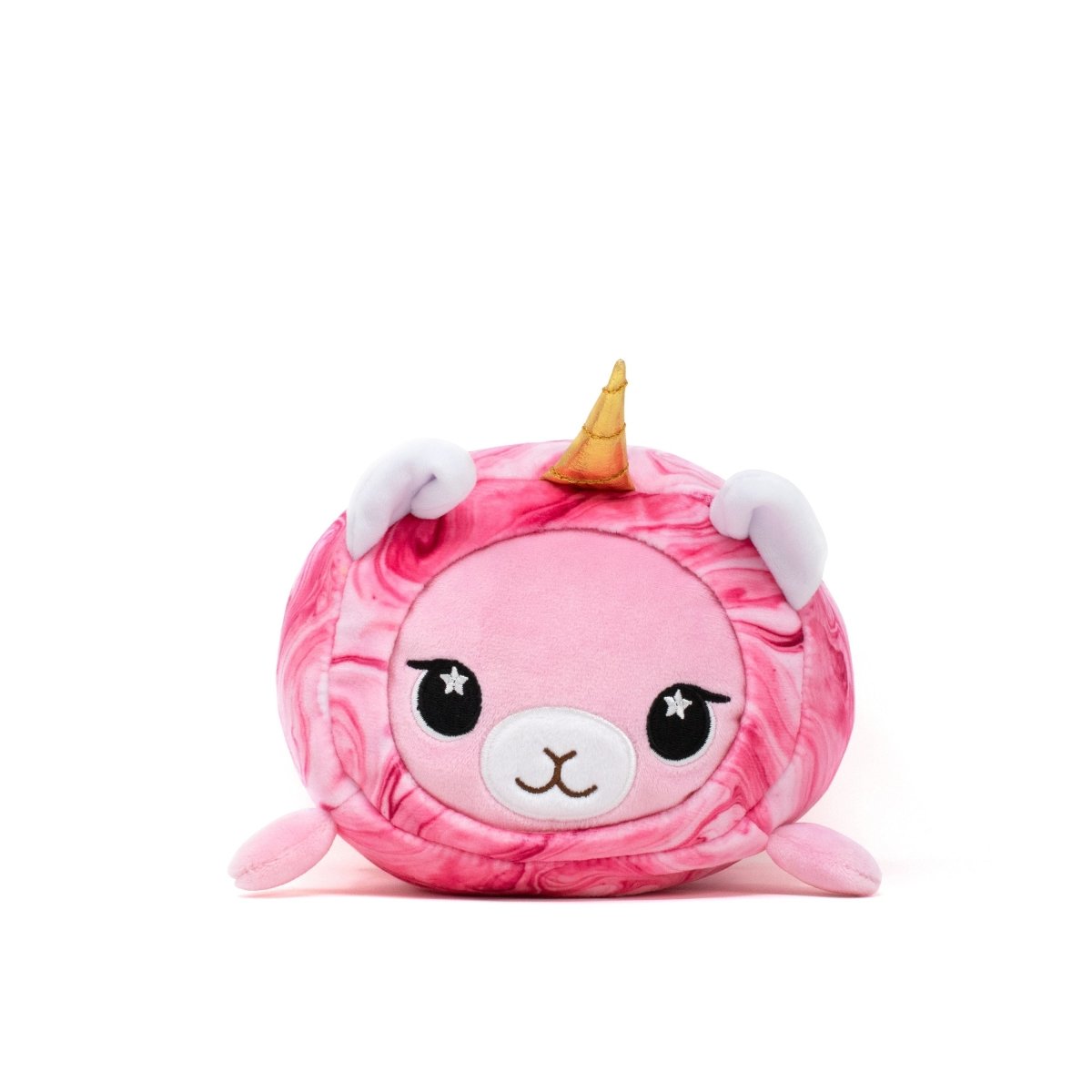 The Lucy Slumber Plushie is a round, pink plush toy with a white face, big eyes, a golden unicorn horn, and small ears. It resembles a blend of unicorn and sheep with a marble-like pattern on a white background.