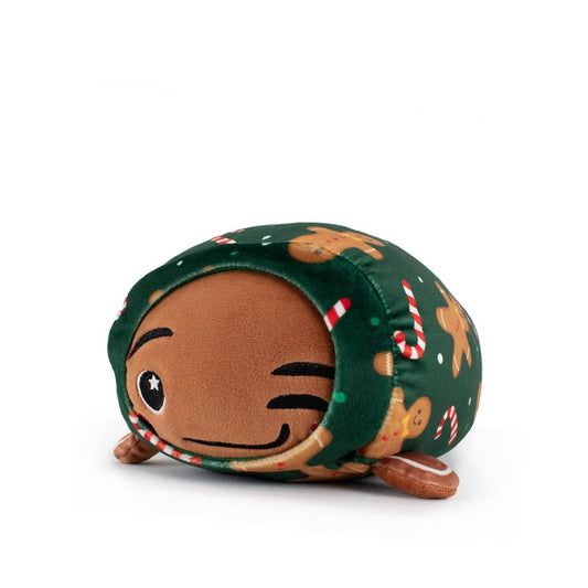 Gingersnaps the Gingerbread Slumber is a cuddly plush turtle toy with a brown winking face, green shell decorated with gingerbread men and candy canes—perfect for holiday plushie collections. Background is plain white.