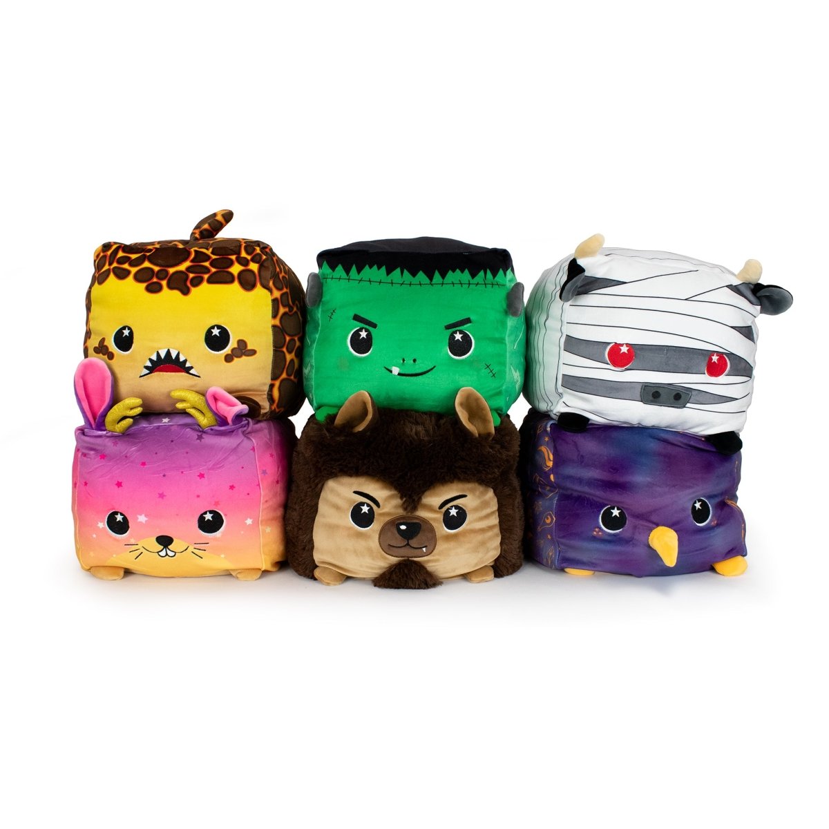 Six ultra-soft plush buddies, including Van the Werewolf, a giraffe, Frankenstein’s monster, a mummy, a bunny, and a purple owl, are arranged in two stacked rows with cute faces.
