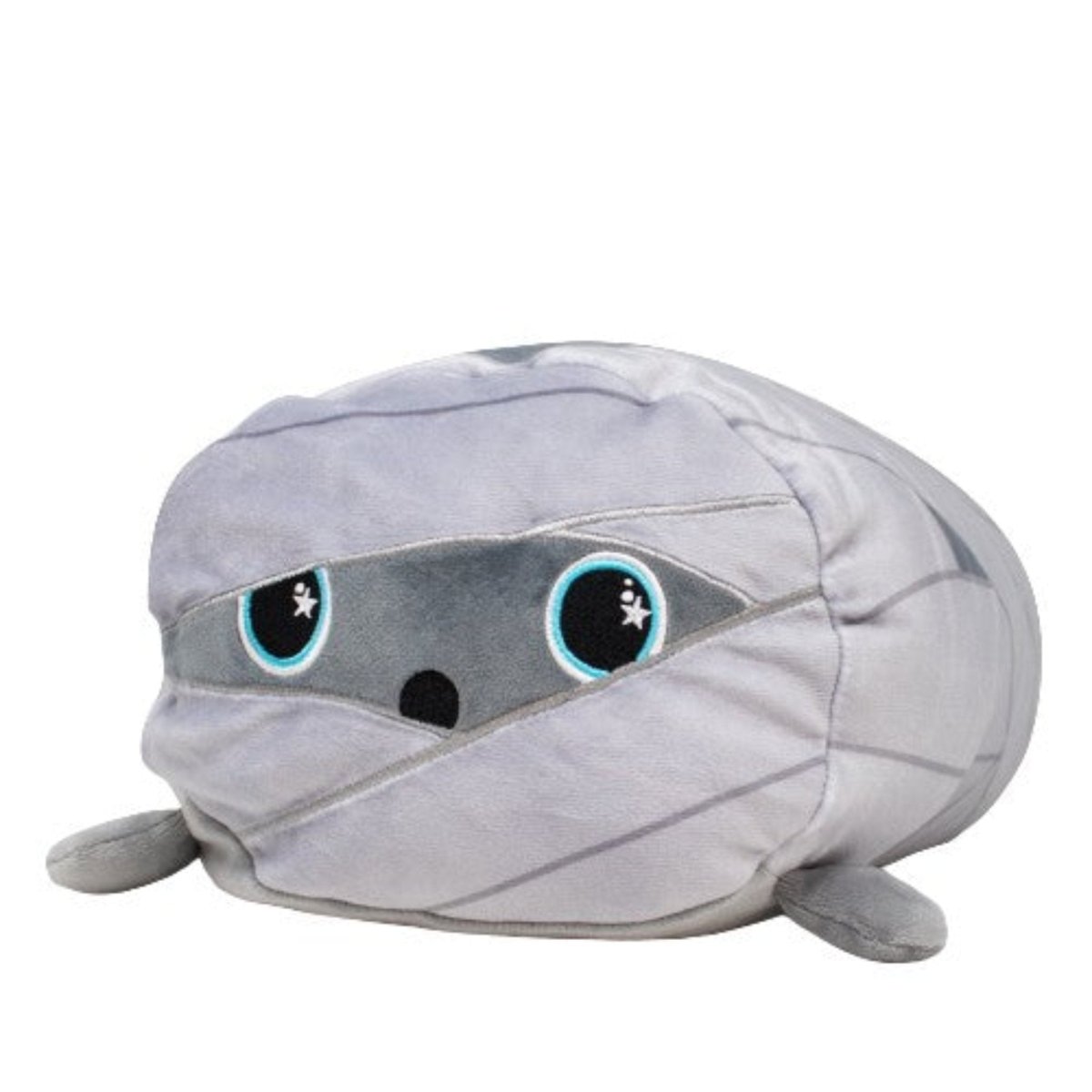 Nile the Mummy Plushie features gray wrappings and large, cute eyes. Its rounded shape and small limbs give it a charming, cuddly appearance.