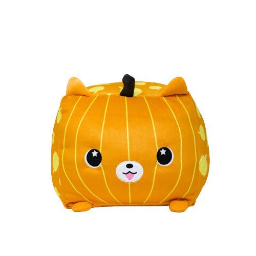 The Pom-Kin the Pomeranian Pumpkin is a cube-shaped plush toy resembling a smiling orange cat with pointy ears and starry eyes, adorned with lighter stripes, paw prints, and a small brown stem on top—irresistibly cute!.