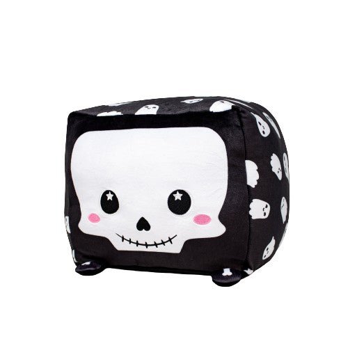 Skully the Skeleton is a soft, black plush cube featuring a smiling skull with rosy cheeks and starry eyes on the front. The sides are adorned with smaller skulls against a black background, making it an adorable addition to any stuffed animal collection.