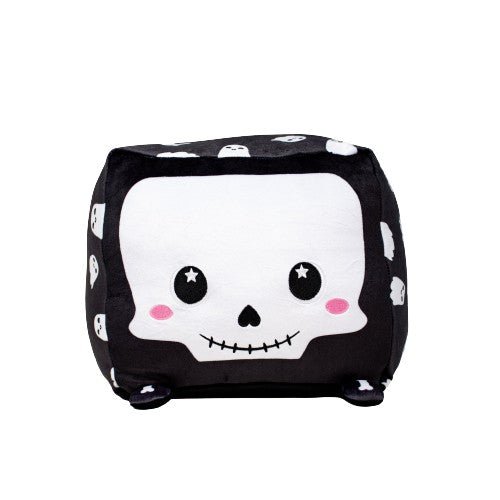 Skully the Skeleton is a cute, black cubic stuffed animal featuring a white skull face, rosy cheeks, and star-shaped eyes, with small white skull designs on its sides.