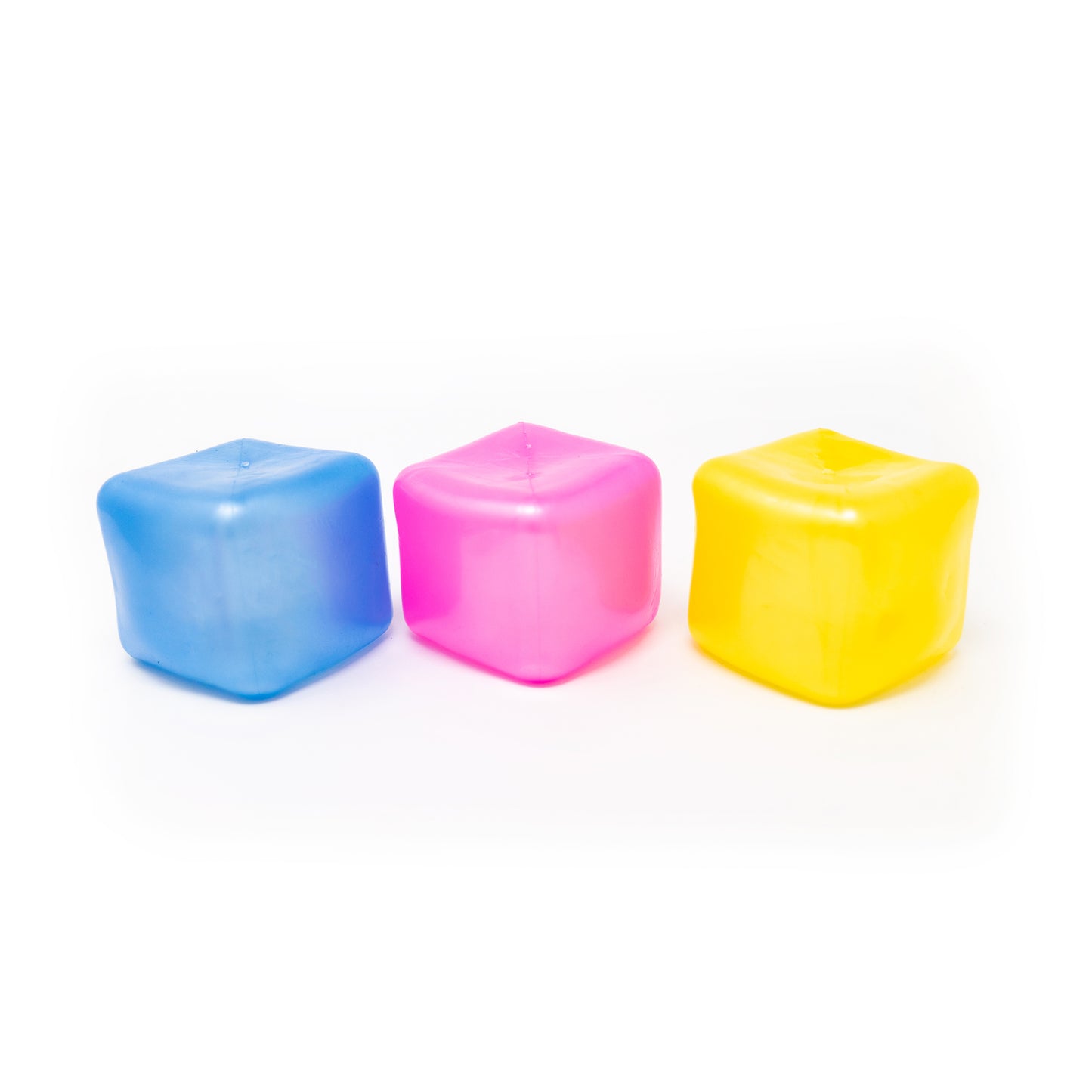 Three Sugah-mal Pearl Cubes from Bubblegum’s Favorite Toy, in blue, pink, and yellow, are arranged in a row on a white background.