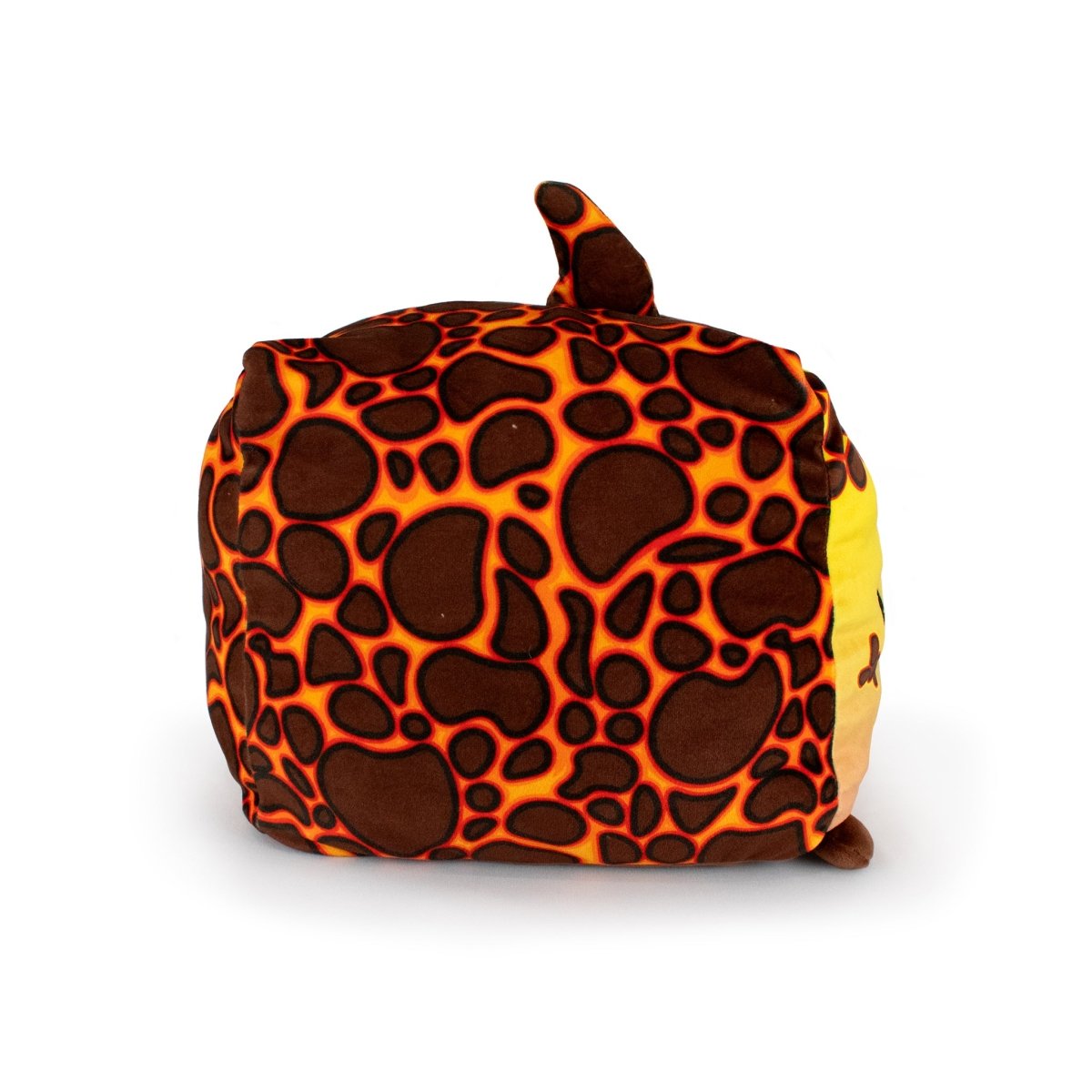 Pele the Lava Shark is an ultra-soft plush toy cube with a giraffe-like brown and orange pattern, a small tail on top, and a brown spot at one corner, shown against a white background.