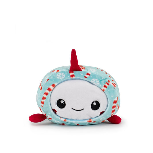 Mintie the Mint Narwhal Slumber is a plush toy with a round white face, big black eyes, and a smiling mouth. It features a light blue body with candy canes and snowflakes, plus red fins and a red horn—perfect for the holidays!.