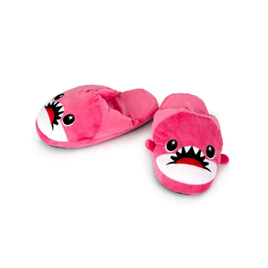 Nibbler the Pink Shark Kids Slipper: pink plush house slippers shaped like sharks with cartoon faces, big eyes, open mouths showing teeth, and non-slip soles for kids.