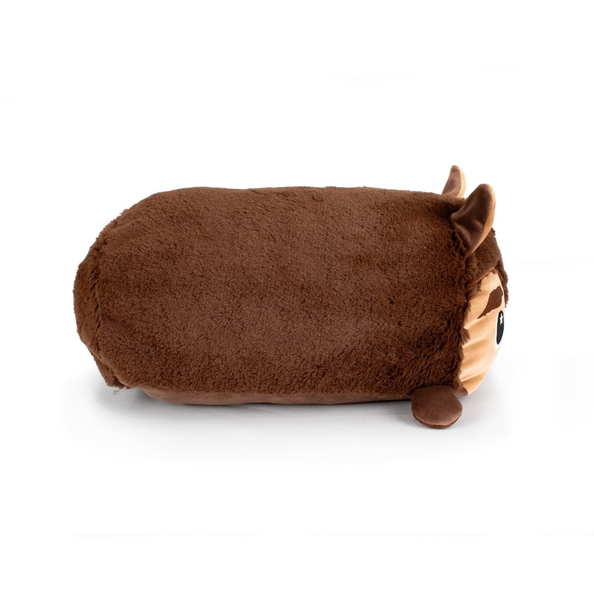 A soft plush toy named Raegan the Werewolf, shaped like a brown rectangular animal with small ears, a round nose, and large eyes, lies on its side against a white background—perfect for stuffed plushie fans.