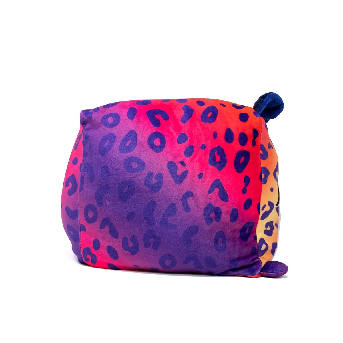 Experience the softness of the Willow Squared Plushie, featuring a rainbow leopard gradient from orange to pink to purple with blue spots. It's complete with small round ears and cute feet at each corner—a perfect addition to any plush collection.