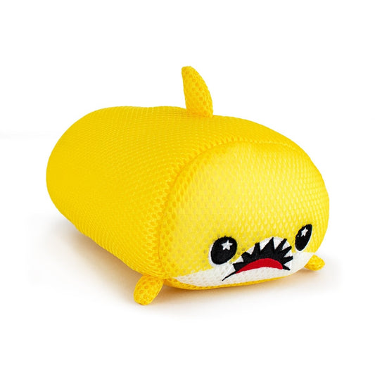 Aqua Moosh-Moosh Dash is a plush toy shaped like a yellow shark, with a rounded body, small fins, a dorsal fin, and a cheerful face featuring wide eyes and a toothy smile.