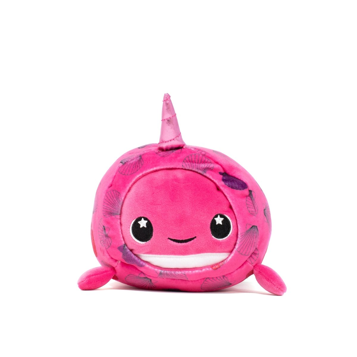 The Bubblegum Slumber Plushie is a pink, round narwhal pillow with shiny eyes, a small smile, and a short, pointed horn with leaf patterns. Featuring small flippers and a tail, this soft and squishy plushie sits on a white background. It's machine washable for easy care.