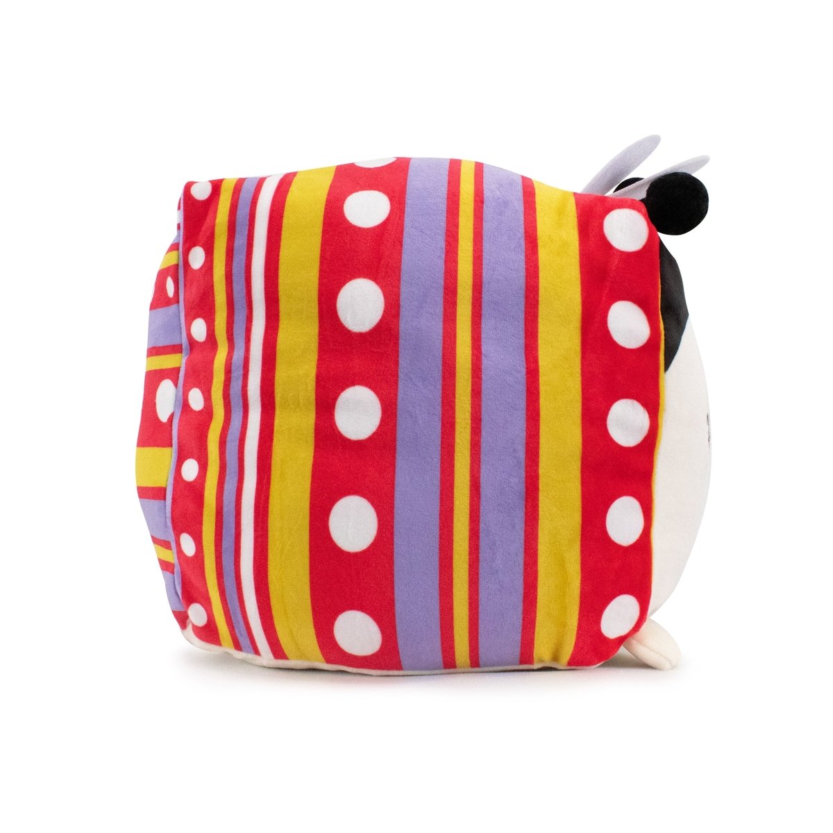 Avril the Ladybug Plushie features a rectangular body adorned with colorful stripes and polka dots in red, yellow, purple, and white. Its side profile reveals black and white ears at the top and bottom, providing sensory softness similar to an Easter stuffed toy.