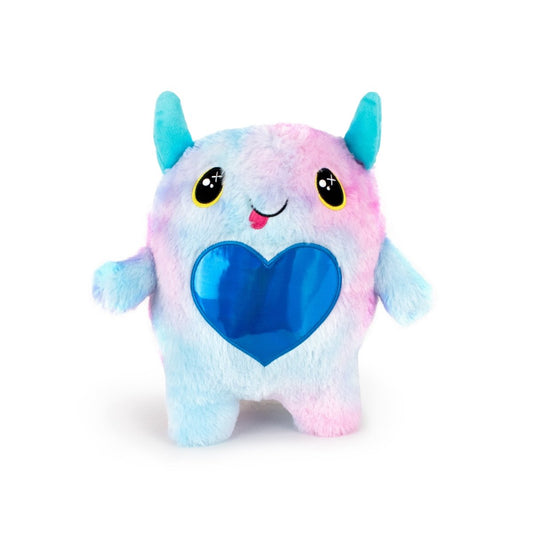 The Cow Bestie Monstah is a cute, machine washable plush toy with pastel blue and pink fur, big yellow and black eyes, a smiling face with its tongue out, blue horns, and a shiny blue heart—perfect for fans of soft cuddly toys.