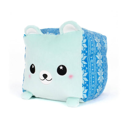 Blitz the Polar Bear is a plush, cube-shaped pillow with a light blue face, rosy cheeks, black eyes, snowy patterns, little ears, and tiny feet. Made from ultra-soft materials, this cute bear makes a cuddly companion.