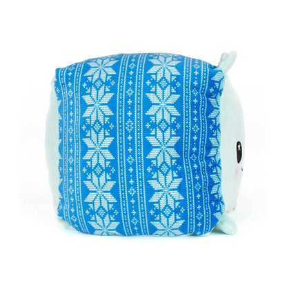 Blitz the Polar Bear is a cuddly plush toy with a blue side panel featuring a white snowflake and geometric knit-like pattern. Made from ultra-soft materials, Blitz’s face and light blue ears are partly visible on the right side.