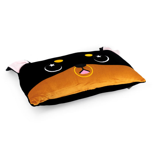 Brewser the Doberman Sleep Pillow is a rectangular, cuddly pillow with black and brown fabric, embroidered eyes, a yellow nose, pink tongue, and small ears—perfect as a cozy stuffed animal pillow for naps.