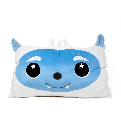 Artie the Yeti Pillow is a rectangular cushion featuring a cute cartoon monster face with large starry black eyes, blue facial area, small fangs, and pointy ears and horns—a whimsical accent for holiday decor. Background is plain white.
