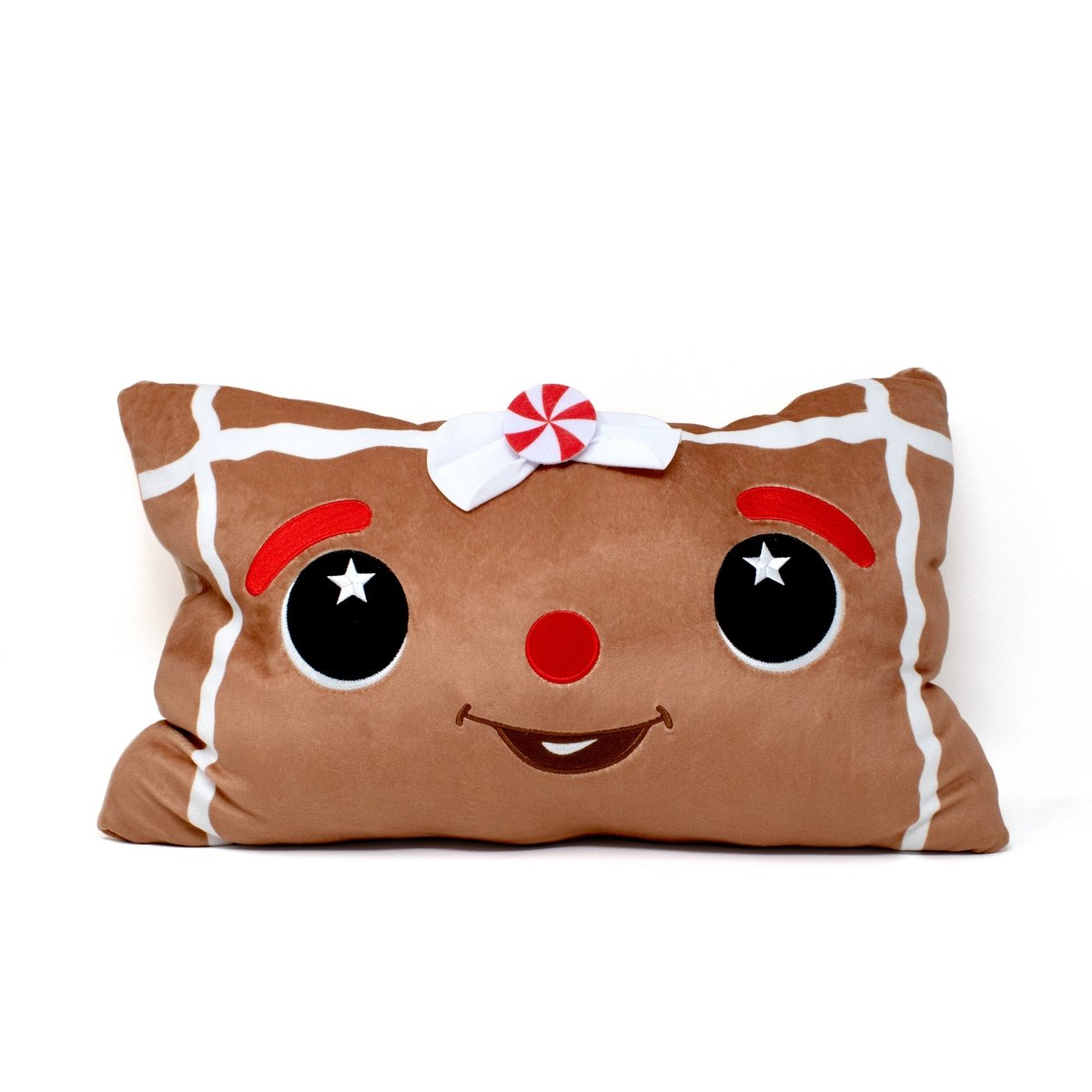 Melani the Gingerbread Pillow features a smiling gingerbread face with big black eyes, red eyebrows, a red nose, white icing details, and a peppermint bow—perfect for sensory squishing and festive holiday decor.