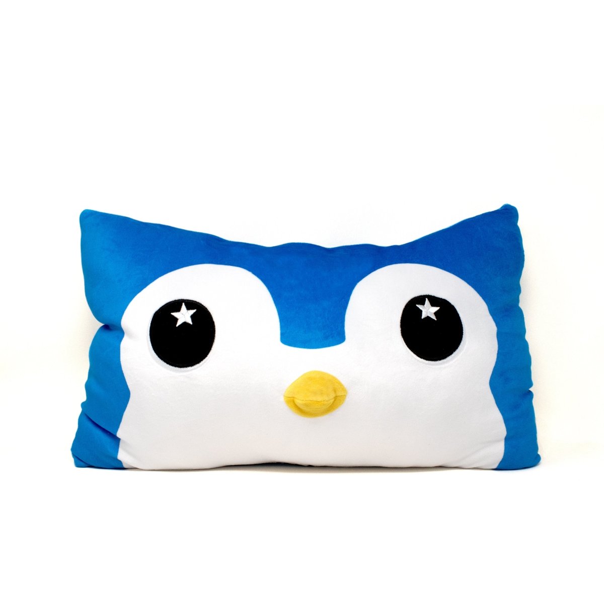 Peckington the Penguin Pillow: a rectangular blue and white plush pillow with a cute cartoon penguin face, featuring big black and white eyes and a yellow beak. Perfect as a cozy accent or holiday decor. Displayed on a plain white background.