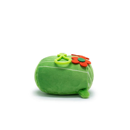 Moosh-Moosh Series 5's Maya the Cactus Plush Clip-On is a soft, round green toy featuring cactus rib lines, a red flower, and a green flower on top. It includes a small leaf on the bottom. Perfect as a miniature plushie for any collection! Background is plain white.