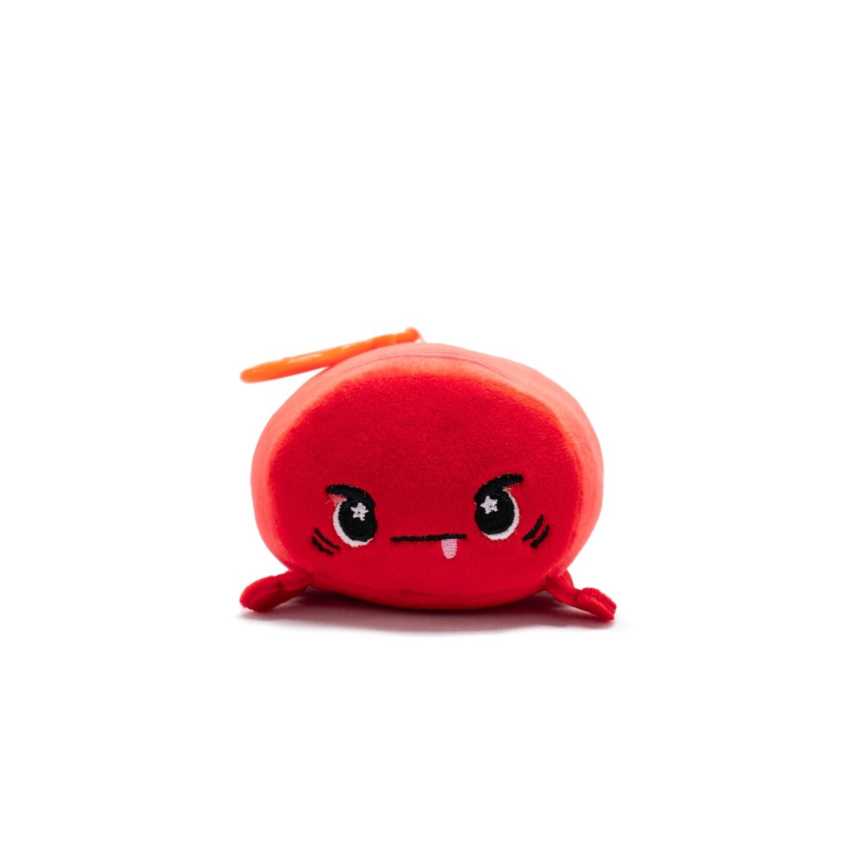 Sebbie the Crab Plush Clip-On is a small, round, red toy with a cute angry expression, cartoonish black eyes with white highlights, and a tiny toothy mouth. Part of the Clip-On collection, it has an orange loop at the top for easy attachment.