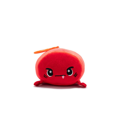 Sebbie the Crab Plush Clip-On is a small, round, red toy with a cute angry expression, cartoonish black eyes with white highlights, and a tiny toothy mouth. Part of the Clip-On collection, it has an orange loop at the top for easy attachment.