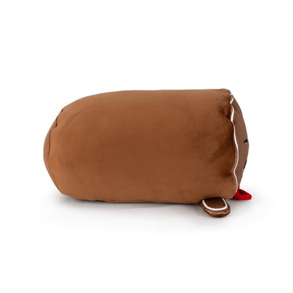 Clovis the Gingerbread Man is a soft, brown, cylindrical plush toy with white icing details, a red felt tongue, and an embroidered smile. Machine washable, he resembles a classic gingerbread cookie and lies on his side.