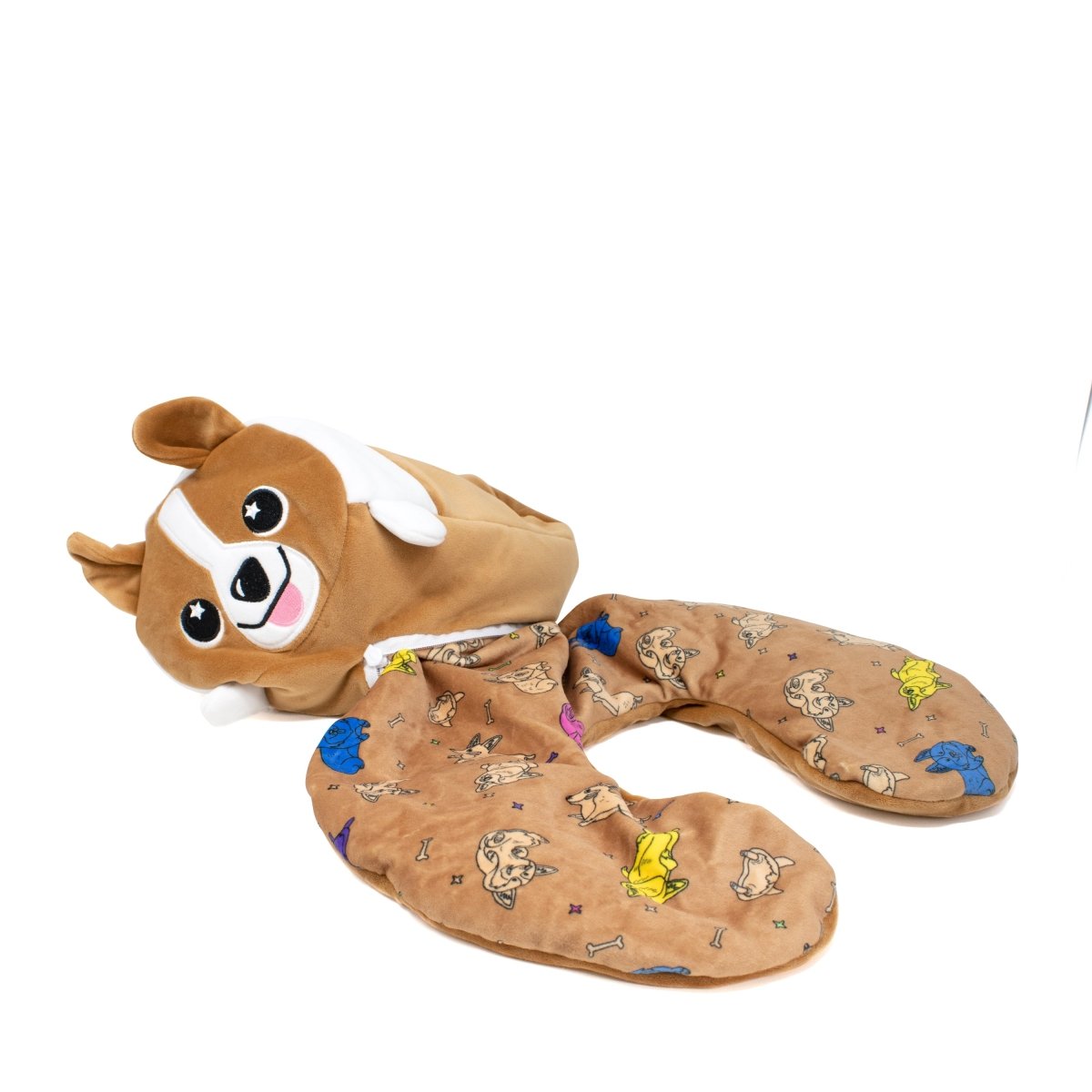 The "Corey the Puppy 2-In-1 Travel Pillow" is a plush, corgi-themed pillow with a brown dog's head and floppy ears. The light brown background showcases playful corgi illustrations, making it an ideal stuffed animal companion for any cozy corner.